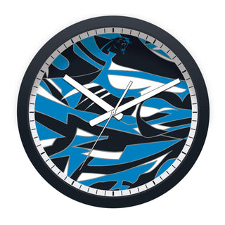 Wall clock with blue and black abstract design on a white background