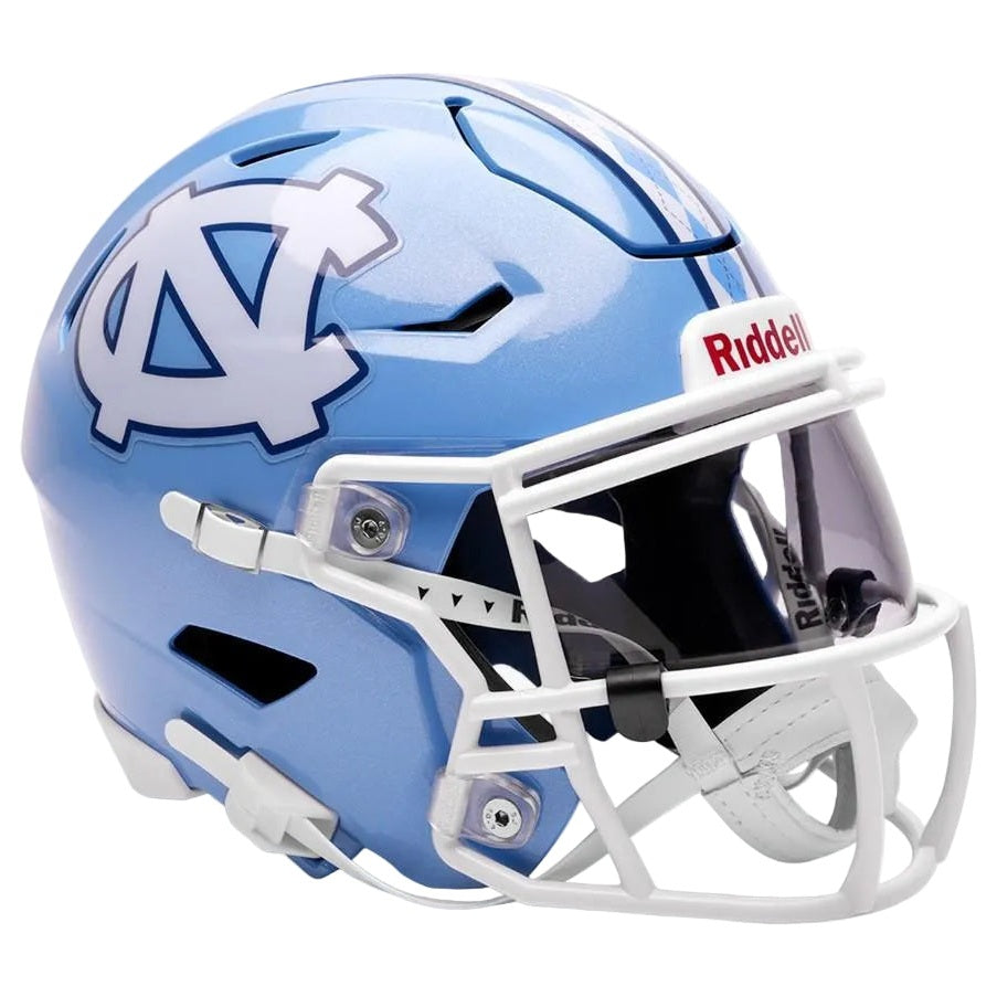 A light blue North Carolina Tar Heels Riddell football helmet with a white facemask and a white UNC logo on the side, shown against a plain white background.