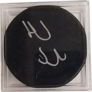 Autographed Hockey Puck: Daniel & Henrik Sedin