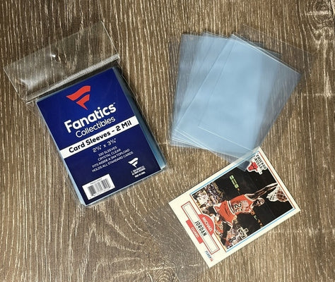 Fanatics penny sleeves with a Michael Jordan Fleer card being sleeved