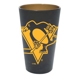 Celebrate in style with the reliable and resilient Pittsburgh Penguins silicone pint glass in a smokey color. This 16oz. glass flaunts your love for the Penguins and adds a touch of fun to your glassware collection! Heat it up or freeze it down - it's microwave and freezer-safe, non-toxic, and unbreakable. Perfect for special occasions, tailgates, camping trips, and everyday enjoyment - this glass is sure to stick with you for years!