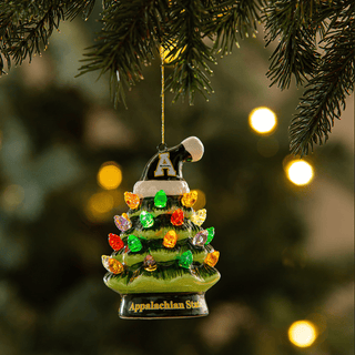 This App State 4" LED Ceramic Christmas Tree Ornament is a festive and unique holiday addition! Crafted from Ceramic and Plastic with no assembly required, it measures 2.55"W x 2.6"L x 3.82"H. Plus, 3x LR44 Batteries are included!