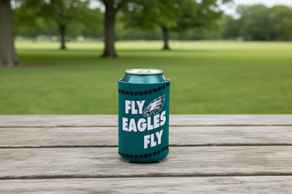 Can cooler with 'Fly Eagles Fly' text and logo on a wooden table outdoors.