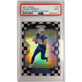 Score a touchdown with the 2021 Panini Prizm Single Card of Justin Herbert from the Los Angeles Chargers! This PSA 9 graded card features a bold black and white checker design, making it a must-have for NFL fans. Don't miss your chance to bring home card #169!